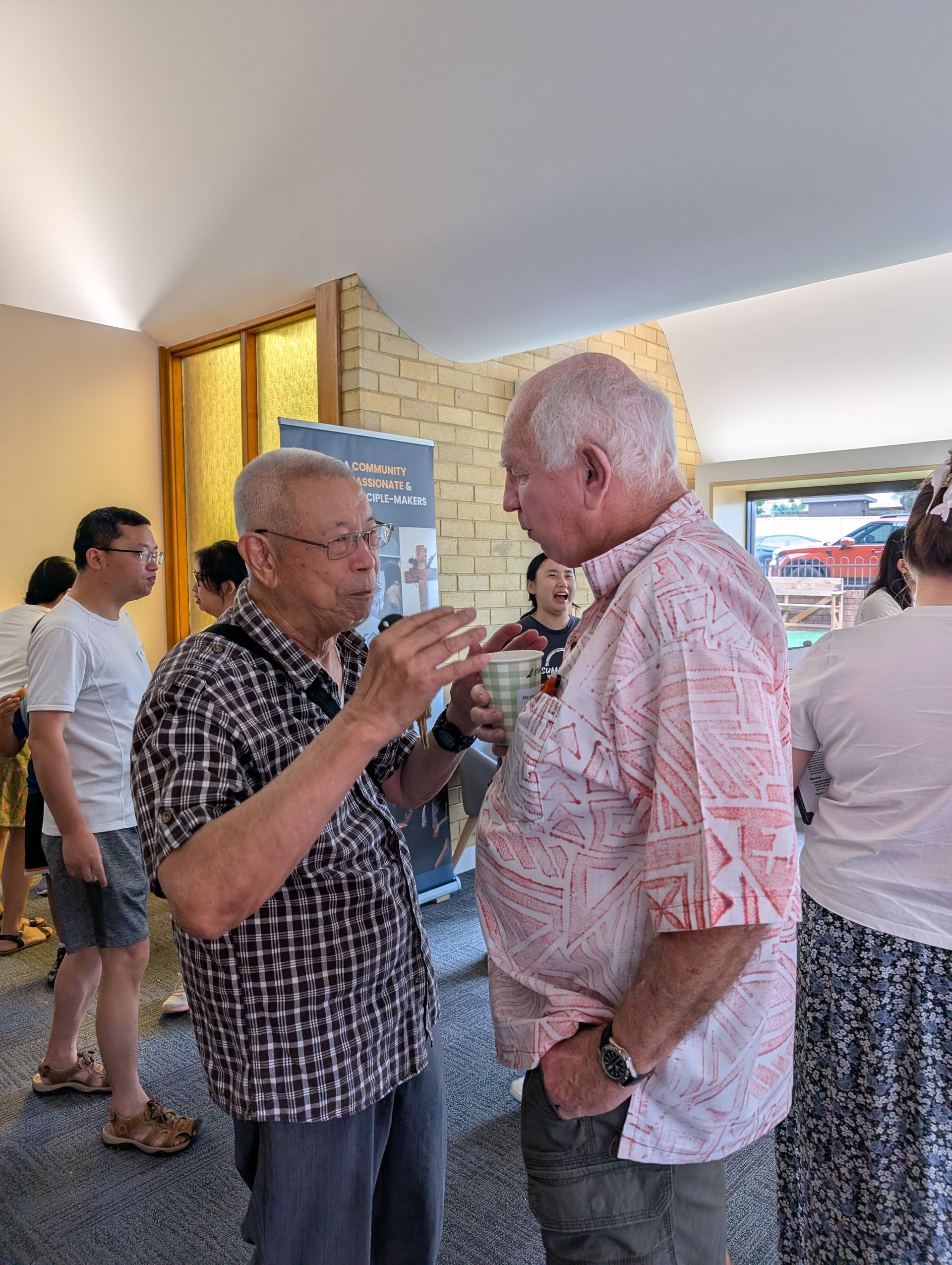 Two church elders in friendly conversation
