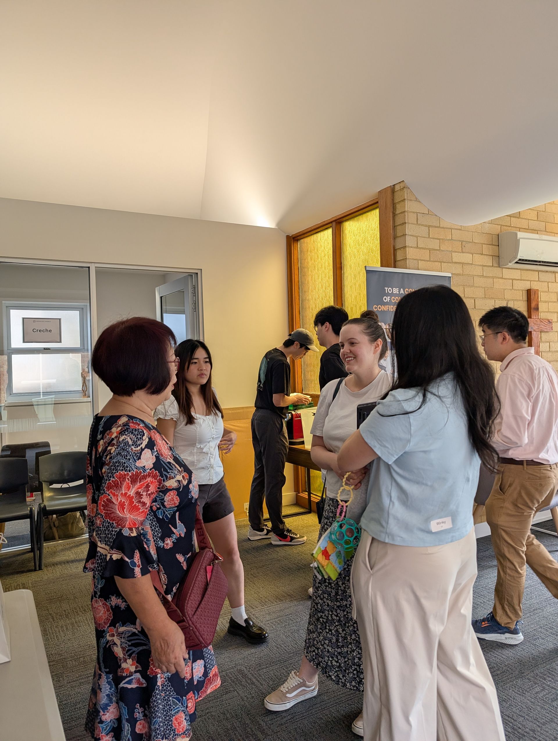 Church members chatting in the foyer after service